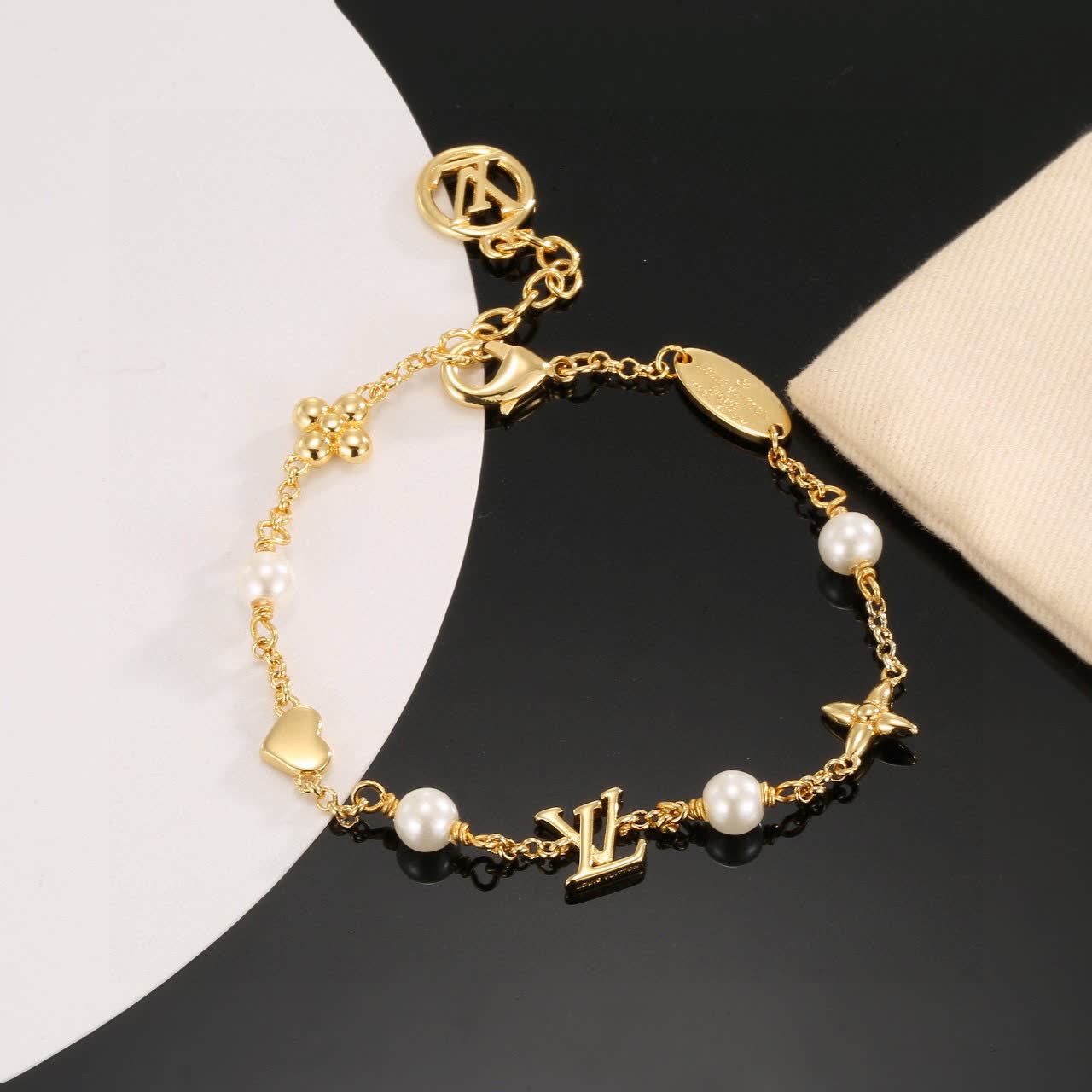 Louis Vuitton Gold Tone Bracelet with Pearls and Charms